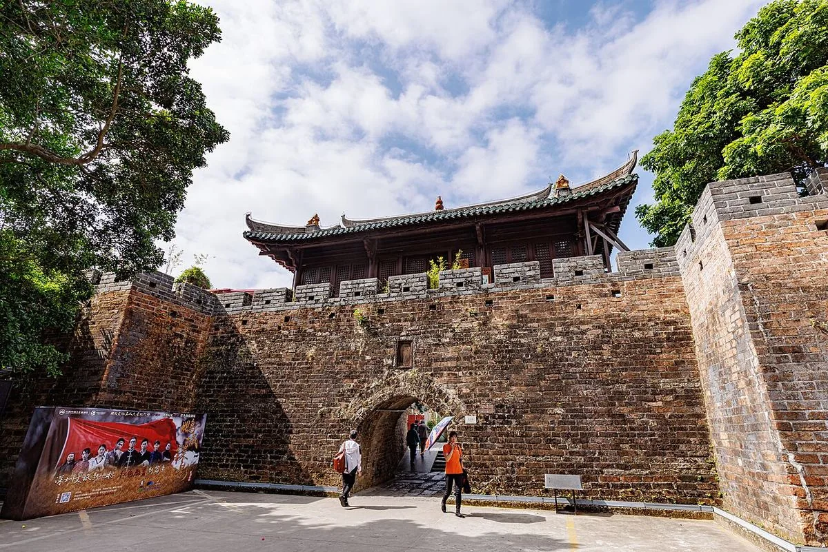 A stone gateway and tower at Dapeng Fortress.