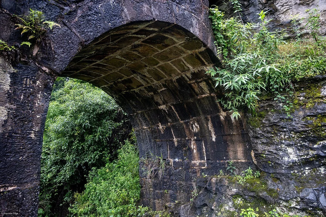 An arched stone gateway at Hailongtun Fortress.