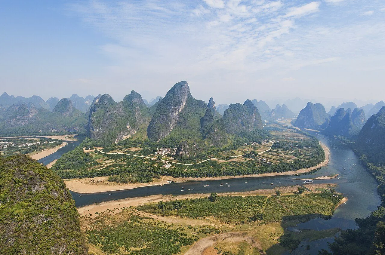 A bend of the Li River among karst hills near Yangshuo.