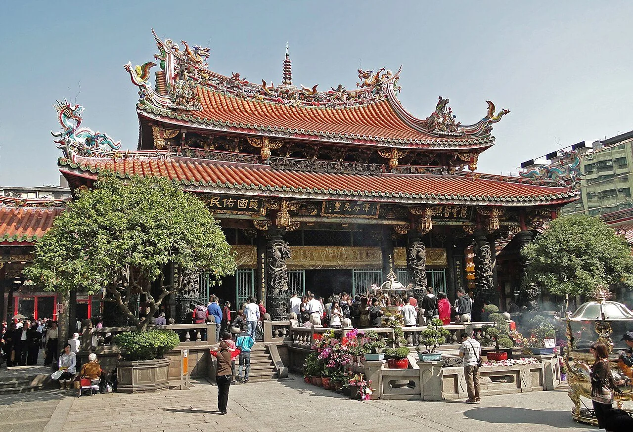The ornate roof and entrance of Lungshan Temple in Taipei.